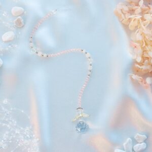 Väike päikesepüüdja roosa kvartsi ja ingliga