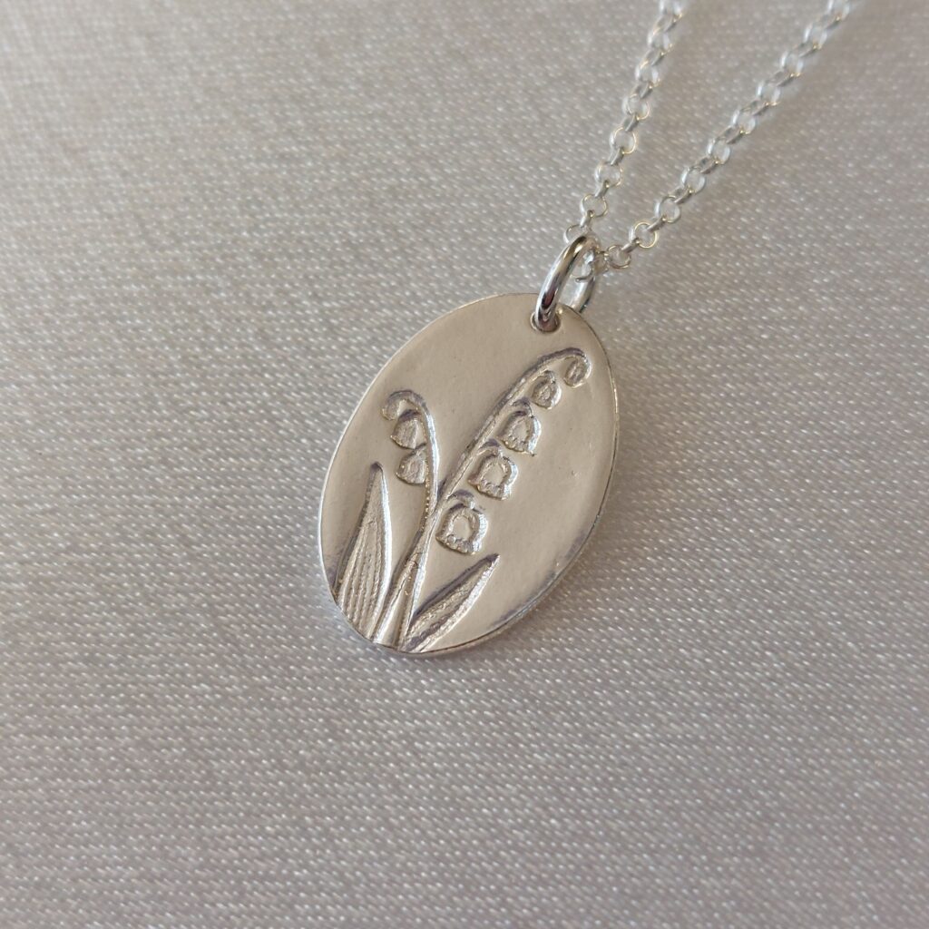 sünnikuu lill, ripats, maikelluke, mai, kaelakee